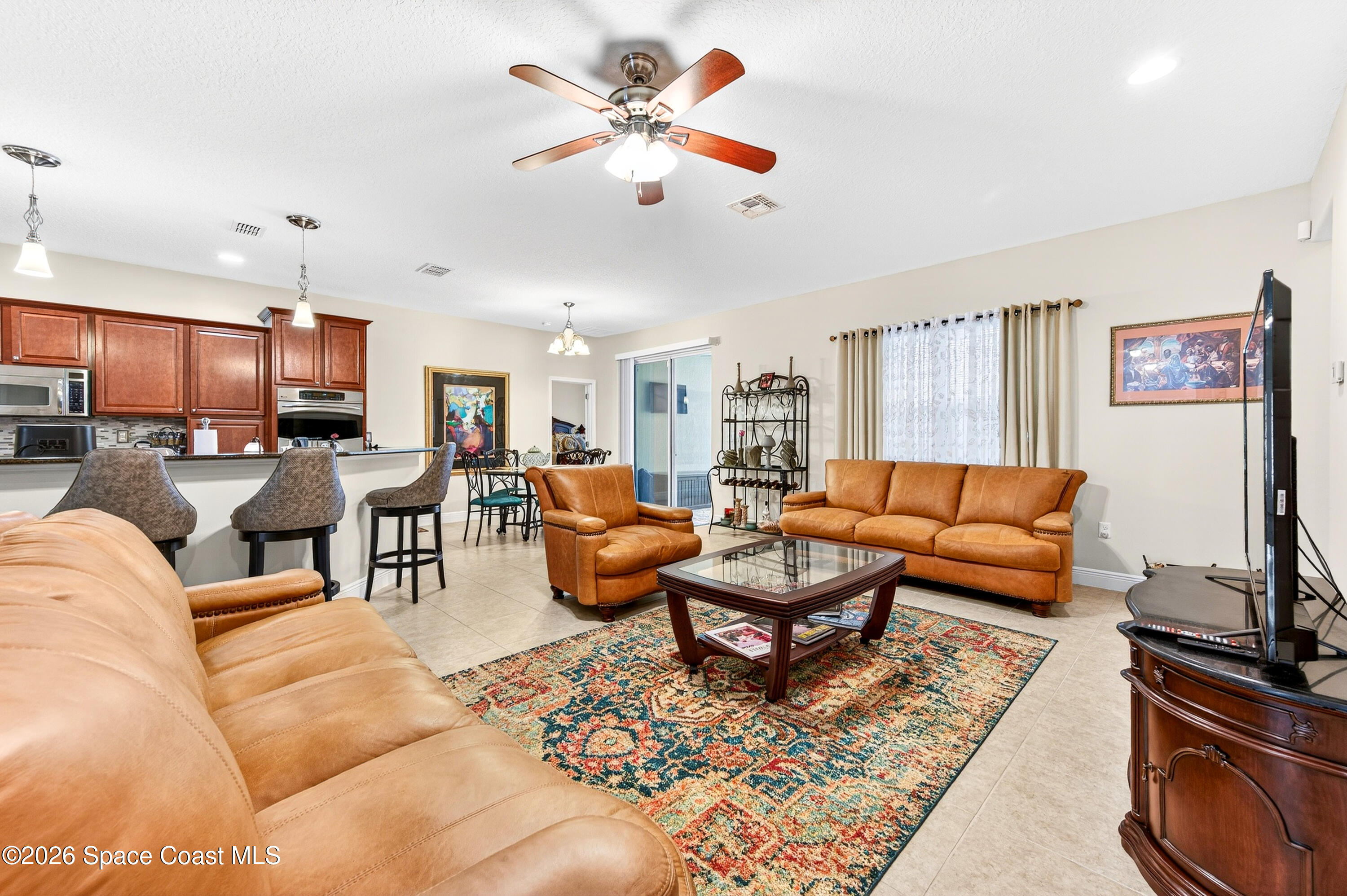 3347 Slate Street Melbourne, FL 32904 - Photo 13 of 48 Family Room open to Kitchen
