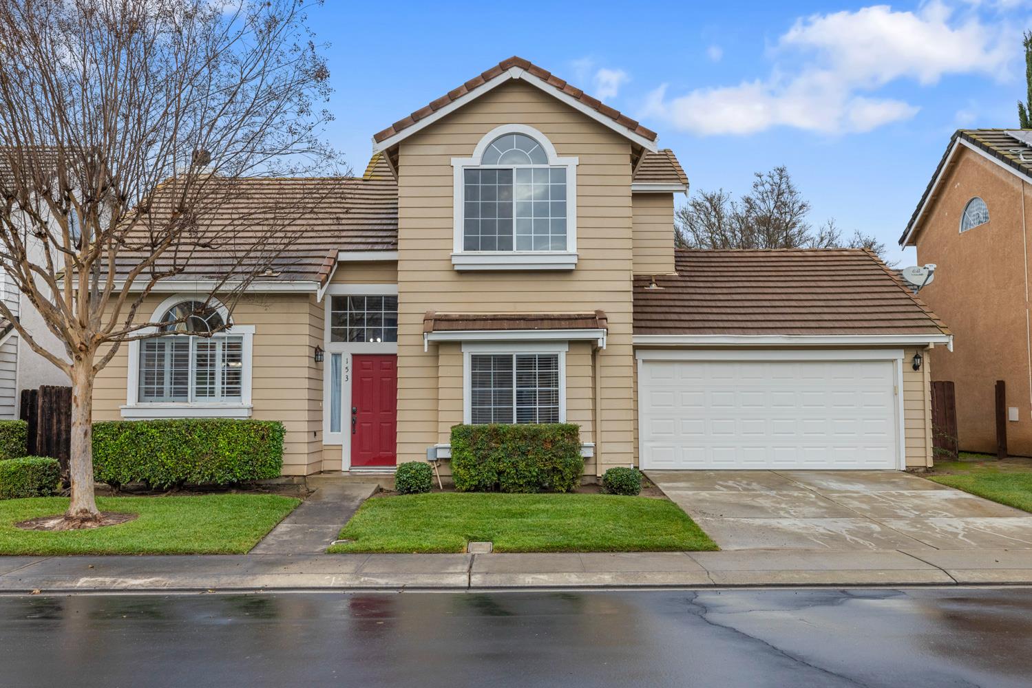 153 Quarry Stone Way Manteca, CA 95336 - Photo 1 of 1 a front view of a house with garage and garage