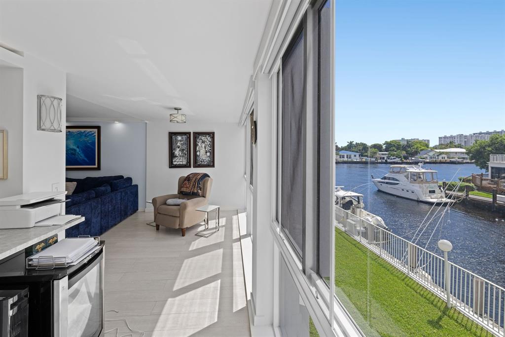 3100 Northeast 49th Street, Unit 206 Fort Lauderdale, FL 33308 - Photo 12 of 39 a living room with furniture