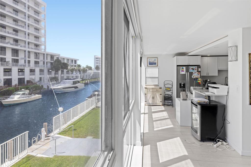 3100 Northeast 49th Street, Unit 206 Fort Lauderdale, FL 33308 - Photo 13 of 39 a view of a living room and kitchen