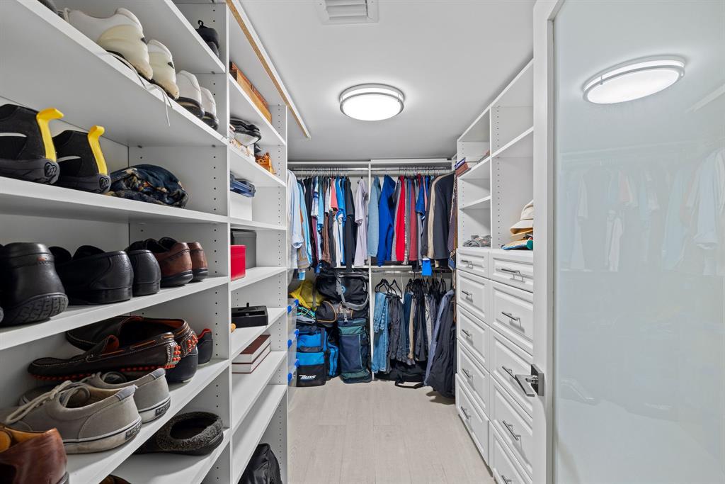 3100 Northeast 49th Street, Unit 206 Fort Lauderdale, FL 33308 - Photo 18 of 39 a view of walk in closet with clothes and shoes