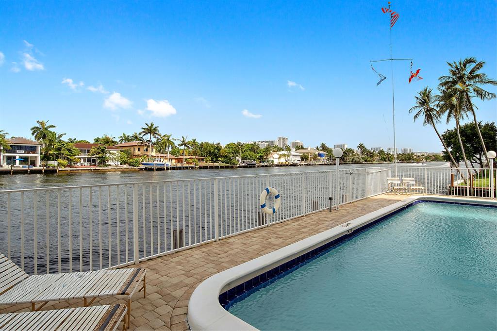 3100 Northeast 49th Street, Unit 206 Fort Lauderdale, FL 33308 - Photo 34 of 39 a view of a lake with a city skyline in the background