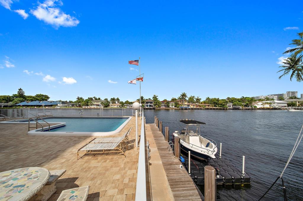 3100 Northeast 49th Street, Unit 206 Fort Lauderdale, FL 33308 - Photo 37 of 39 a view of a lake with couches chairs