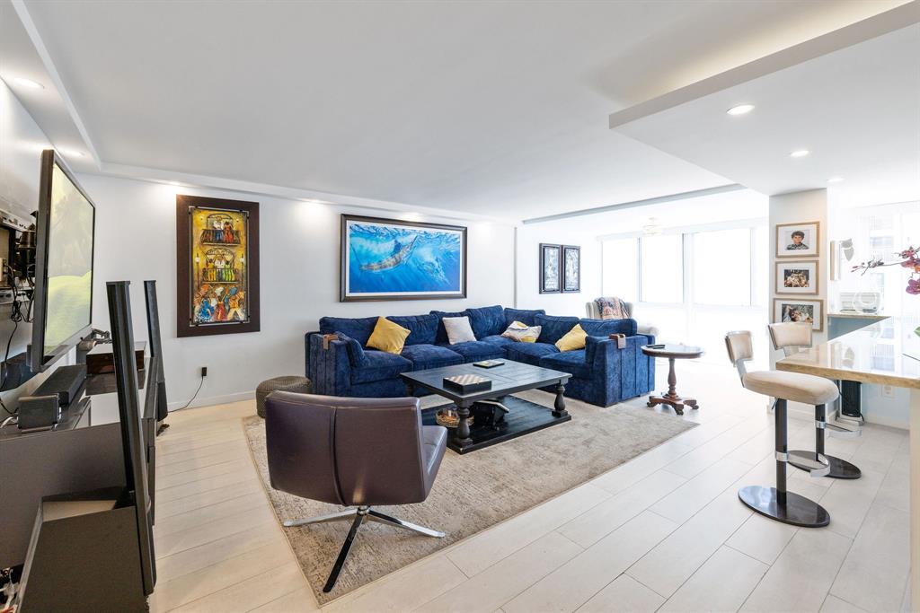 3100 Northeast 49th Street, Unit 206 Fort Lauderdale, FL 33308 - Photo 6 of 39 a living room with lots of furniture and a window