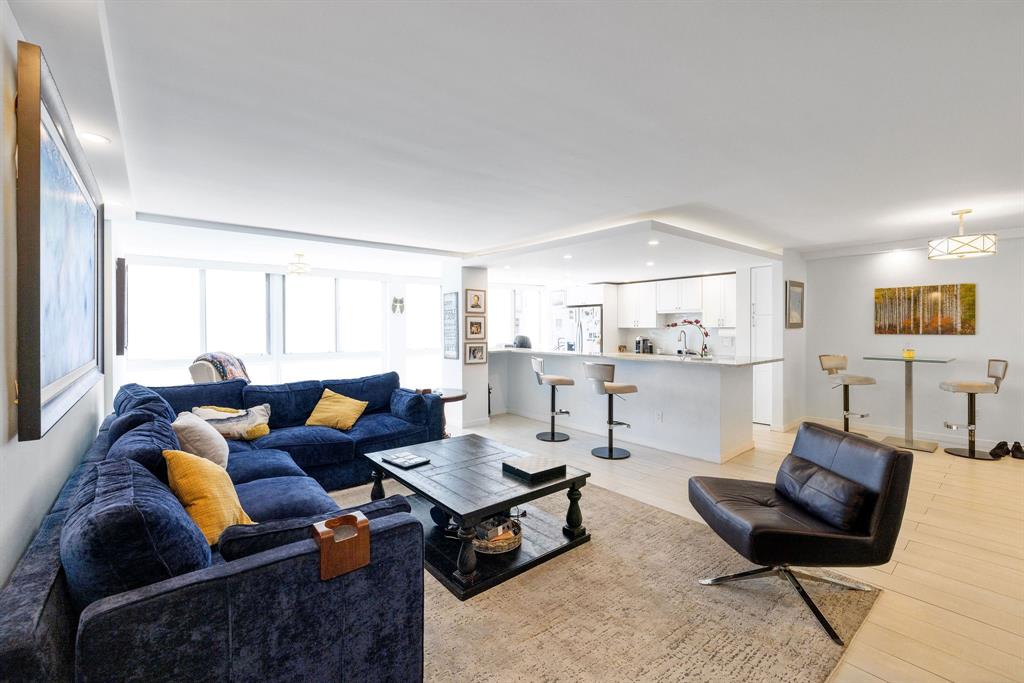3100 Northeast 49th Street, Unit 206 Fort Lauderdale, FL 33308 - Photo 7 of 39 a living room with furniture and a wooden floor