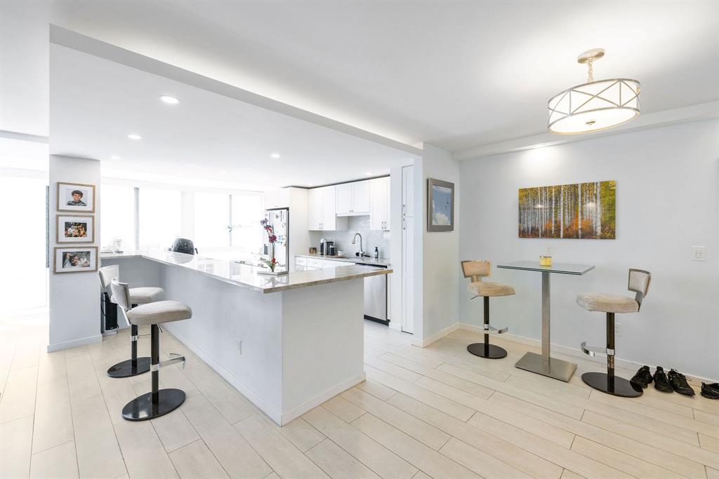 3100 Northeast 49th Street, Unit 206 Fort Lauderdale, FL 33308 - Photo 8 of 39 a view of living room with furniture and wooden floor