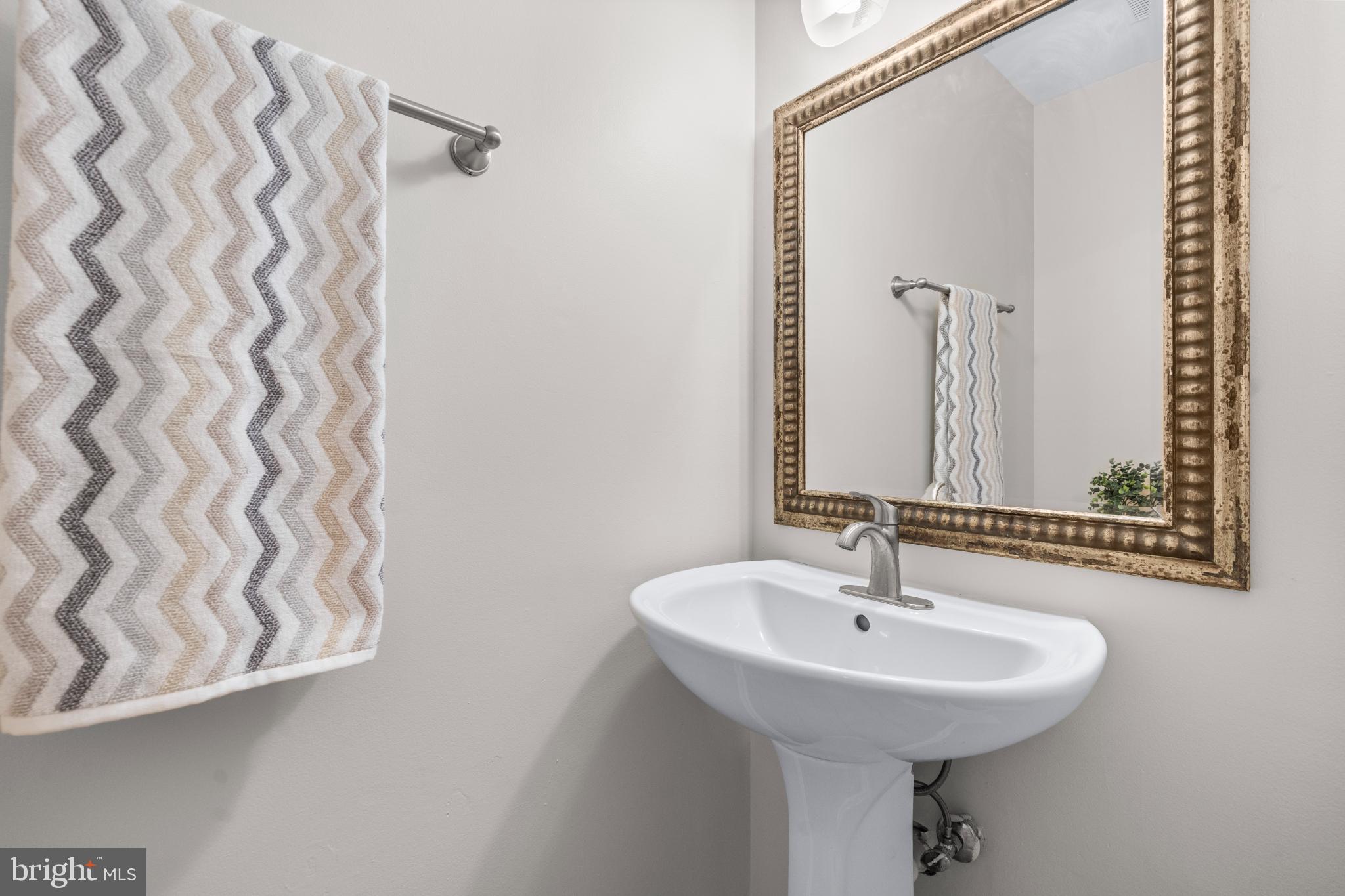 2233 Anvil Lane Temple Hills, MD 20748 - Photo 11 of 21 Half bathroom with vintage mirror charm.