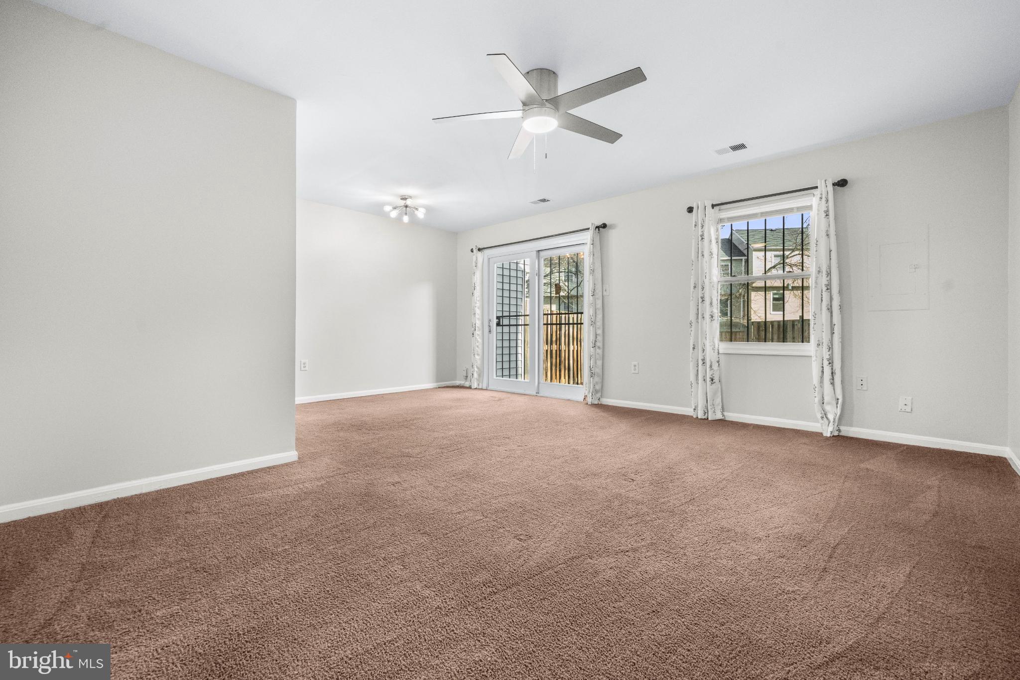 2233 Anvil Lane Temple Hills, MD 20748 - Photo 14 of 21 Spacious, sunlit living area with outdoor access.