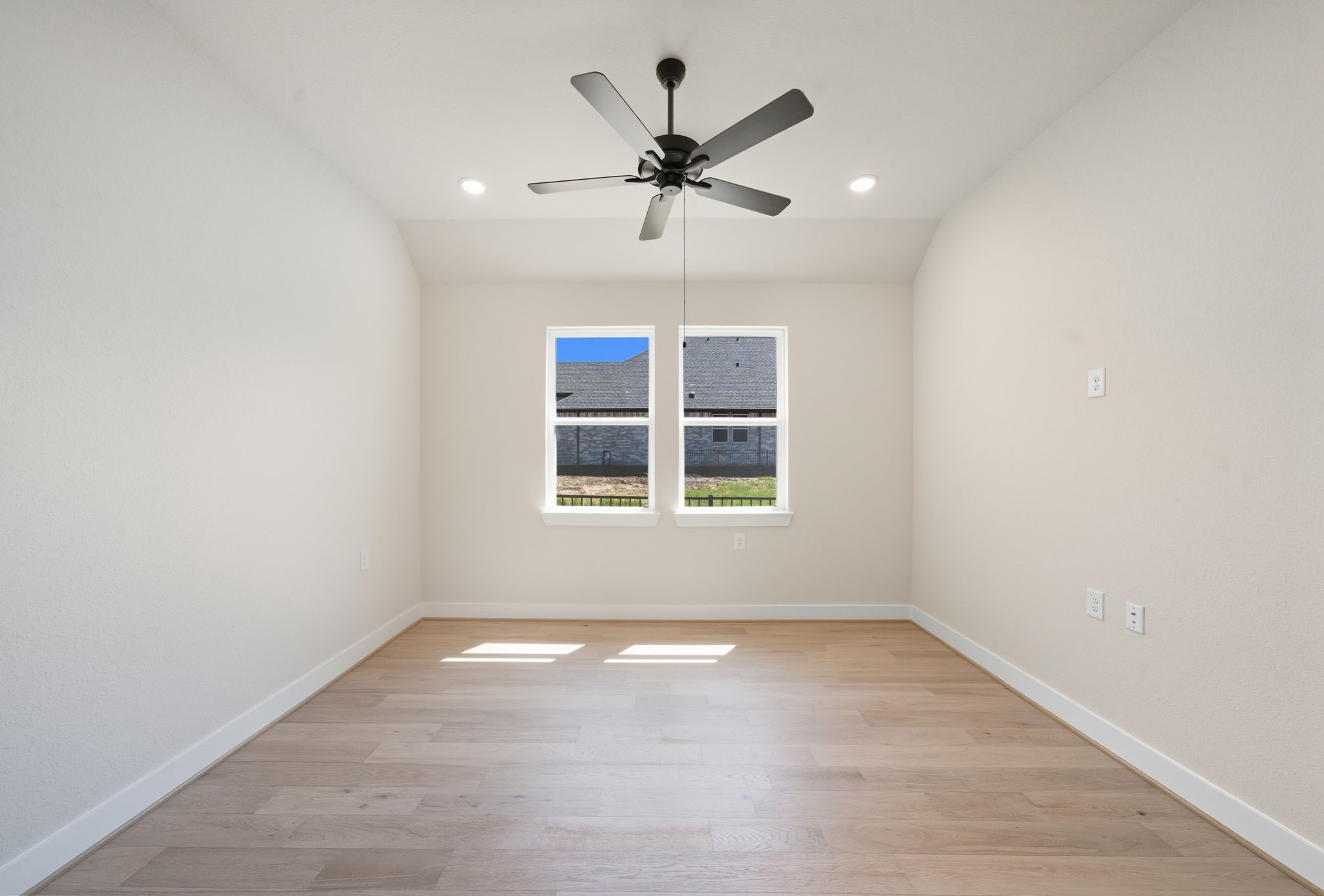 10041 Larkin Cove Willis, TX 77318 - Photo 11 of 48 an empty room with a ceiling fan and window