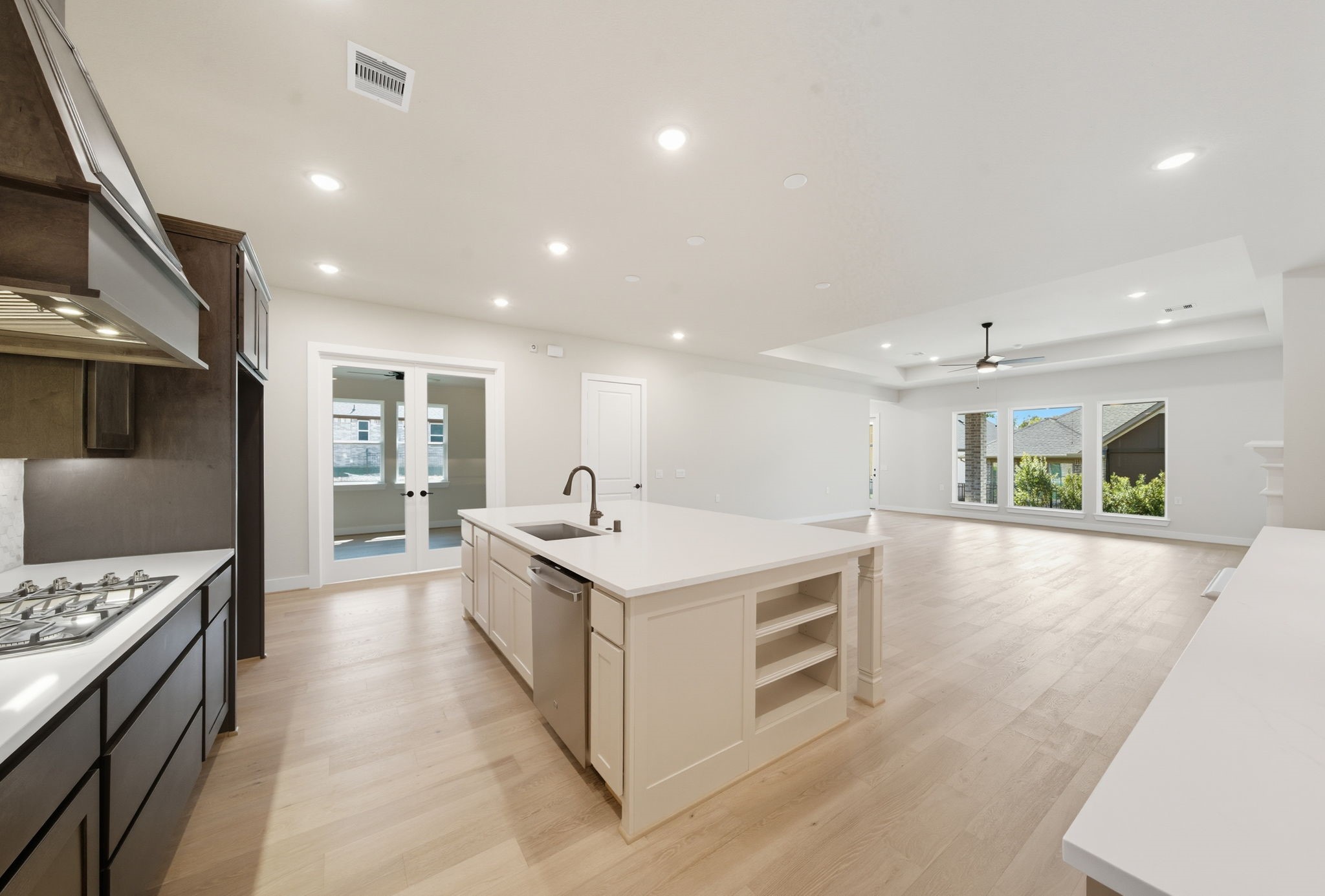 10041 Larkin Cove Willis, TX 77318 - Photo 12 of 48 a large kitchen with stainless steel appliances granite countertop a large counter top and a stove