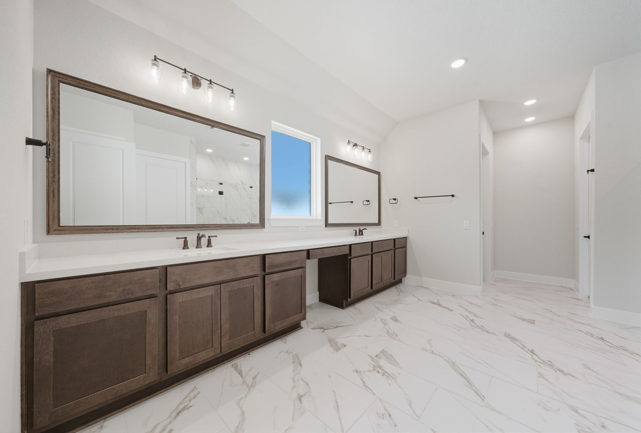 10041 Larkin Cove Willis, TX 77318 - Photo 26 of 48 a spacious bathroom with a double vanity sink and a mirror