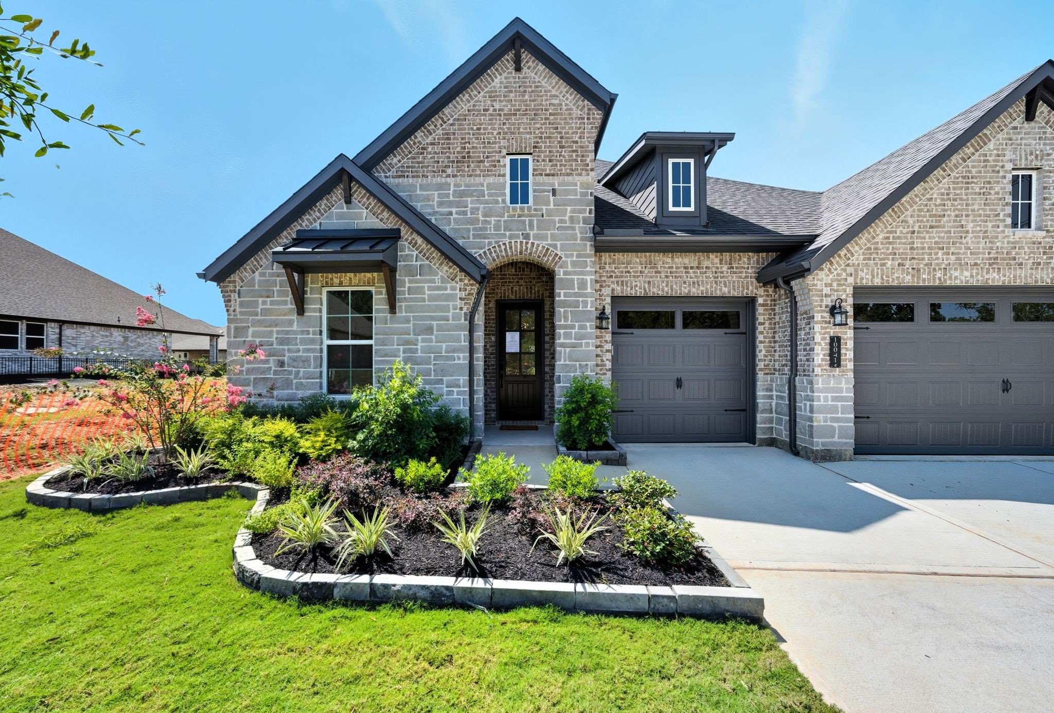 10041 Larkin Cove Willis, TX 77318 - Photo 2 of 48 a front view of a house with a yard