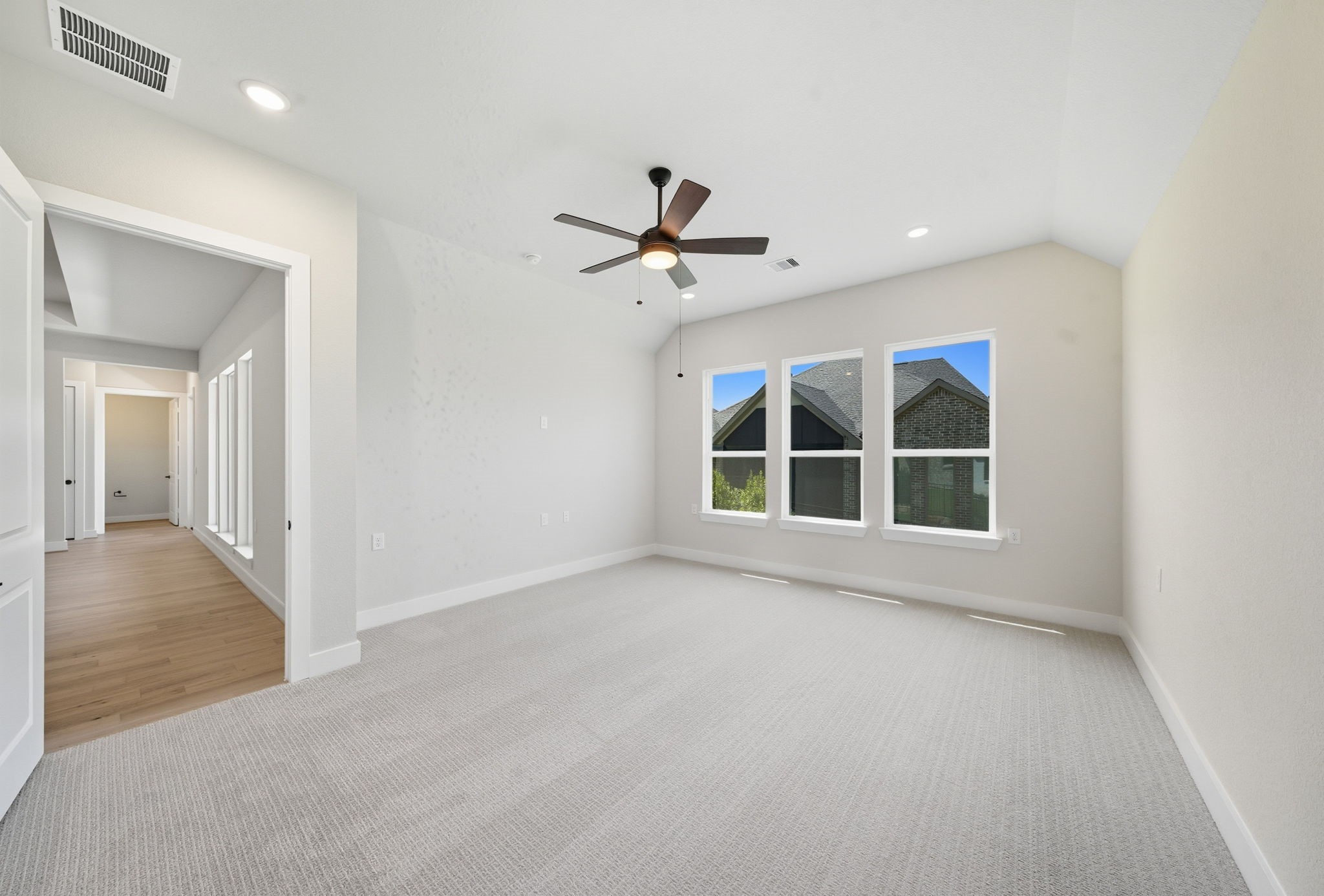 10041 Larkin Cove Willis, TX 77318 - Photo 33 of 48 a view of an empty room with a window and a ceiling fan