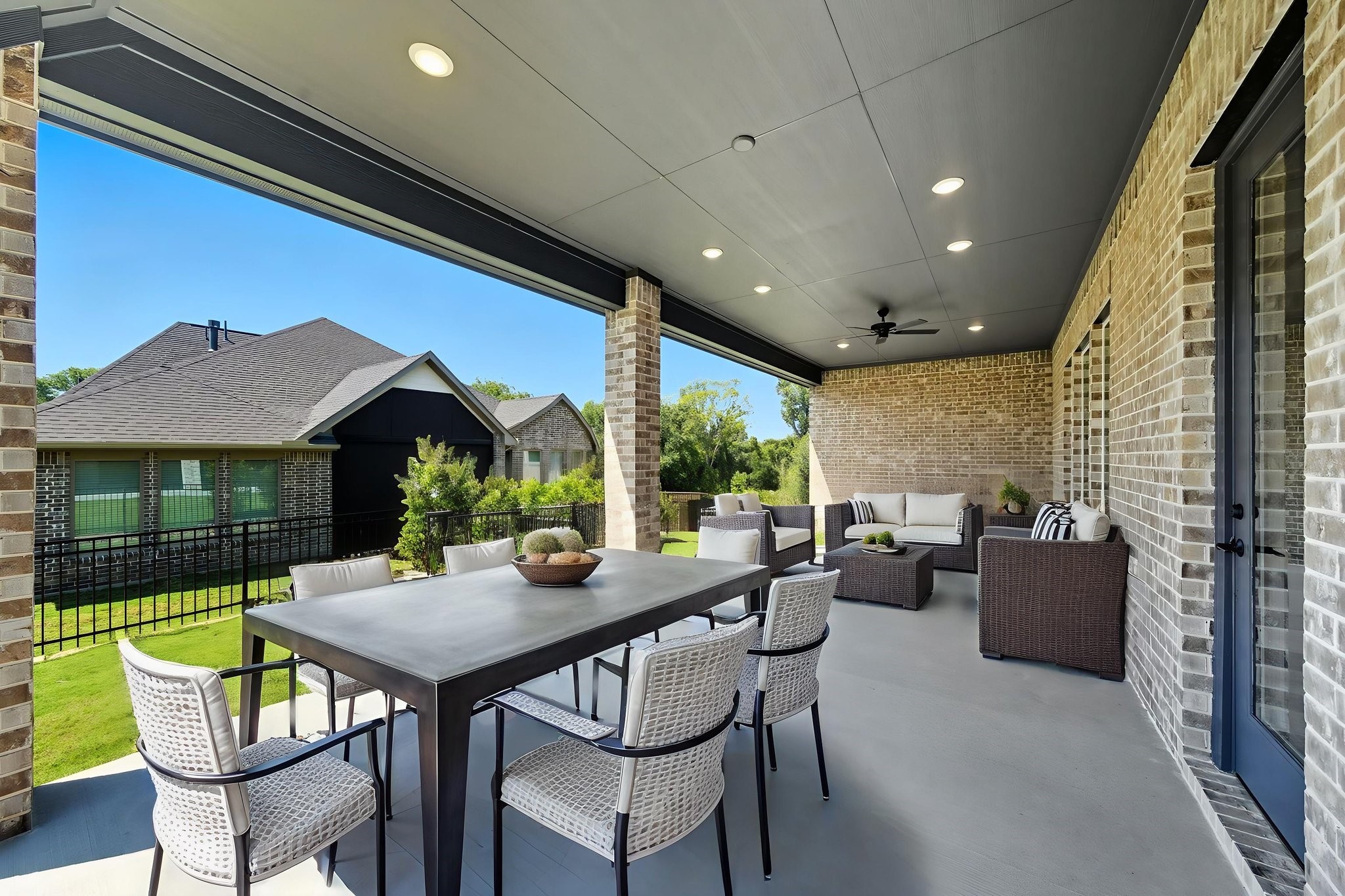 10041 Larkin Cove Willis, TX 77318 - Photo 35 of 48 a view of a patio with a dining table and chairs
