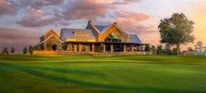 10041 Larkin Cove Willis, TX 77318 - Photo 42 of 48 a front view of a house with a garden