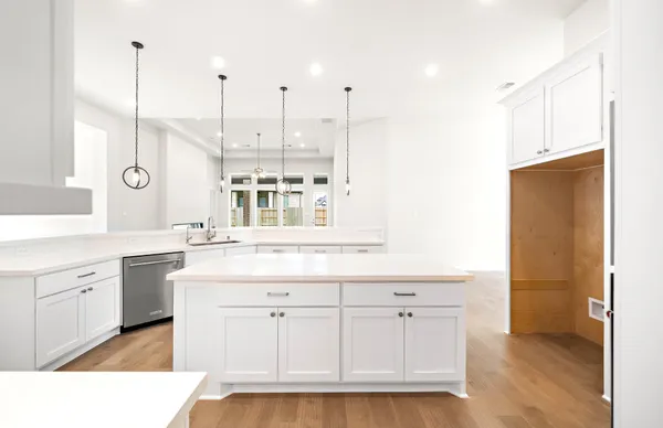 a large kitchen with stainless steel appliances