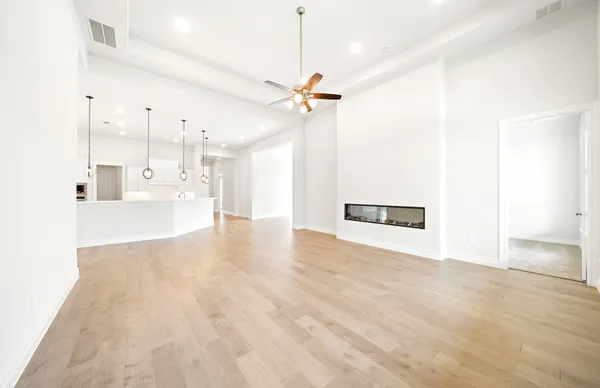 a view interior of a house a ceiling fan and wooden floor