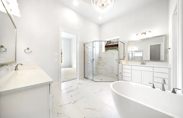 a bathroom with a shower sink and mirror
