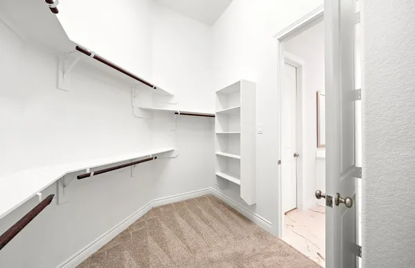 a view of an empty walk in closet