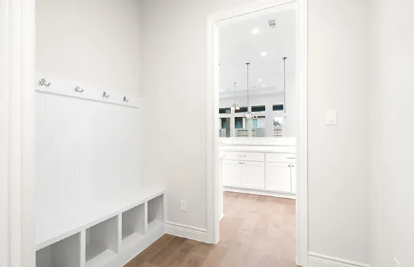 an empty room with windows and closet