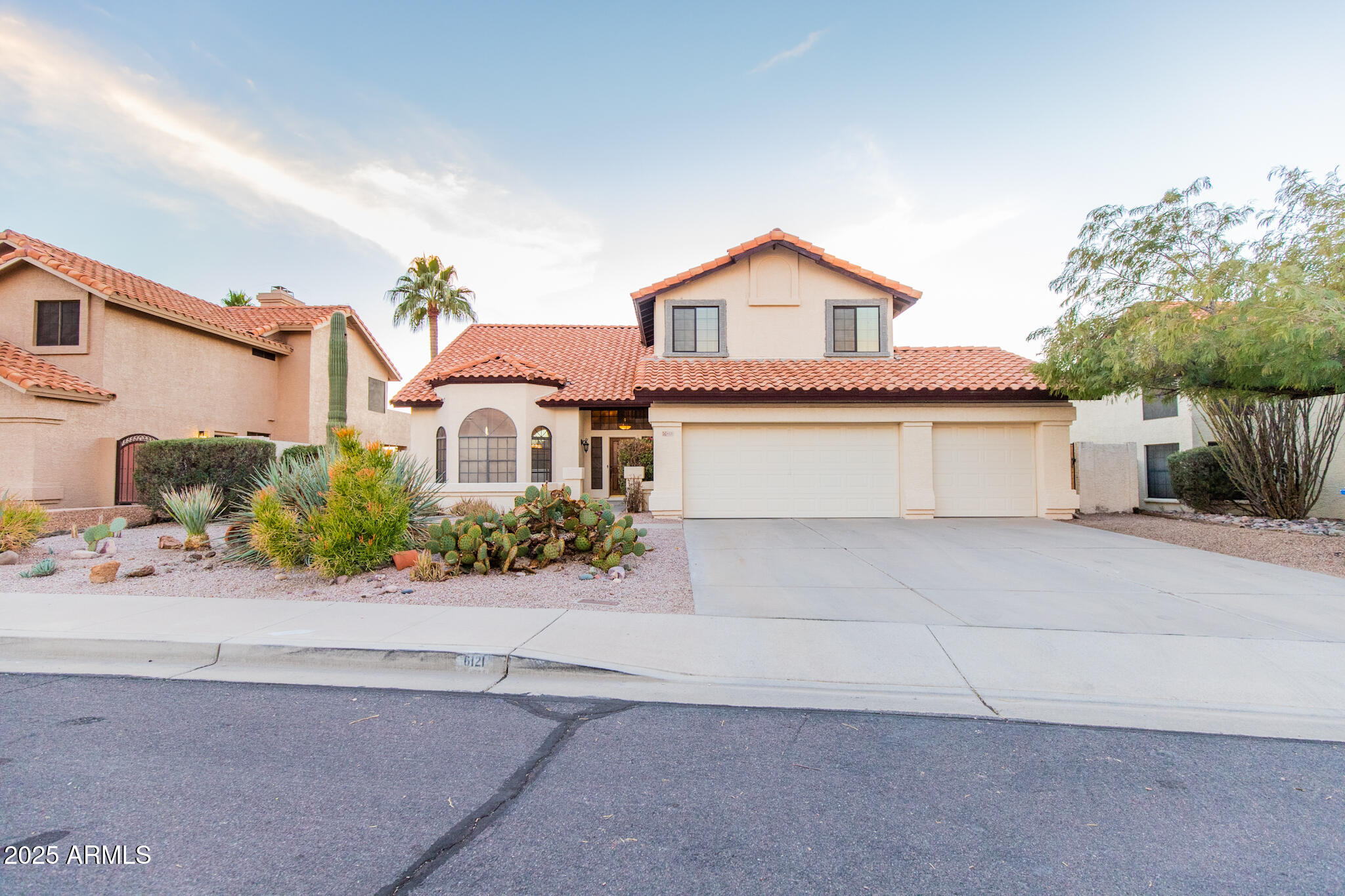 6121 East Saddleback Street Mesa, AZ 85215 - Photo 1 of 36 front view of house with a street