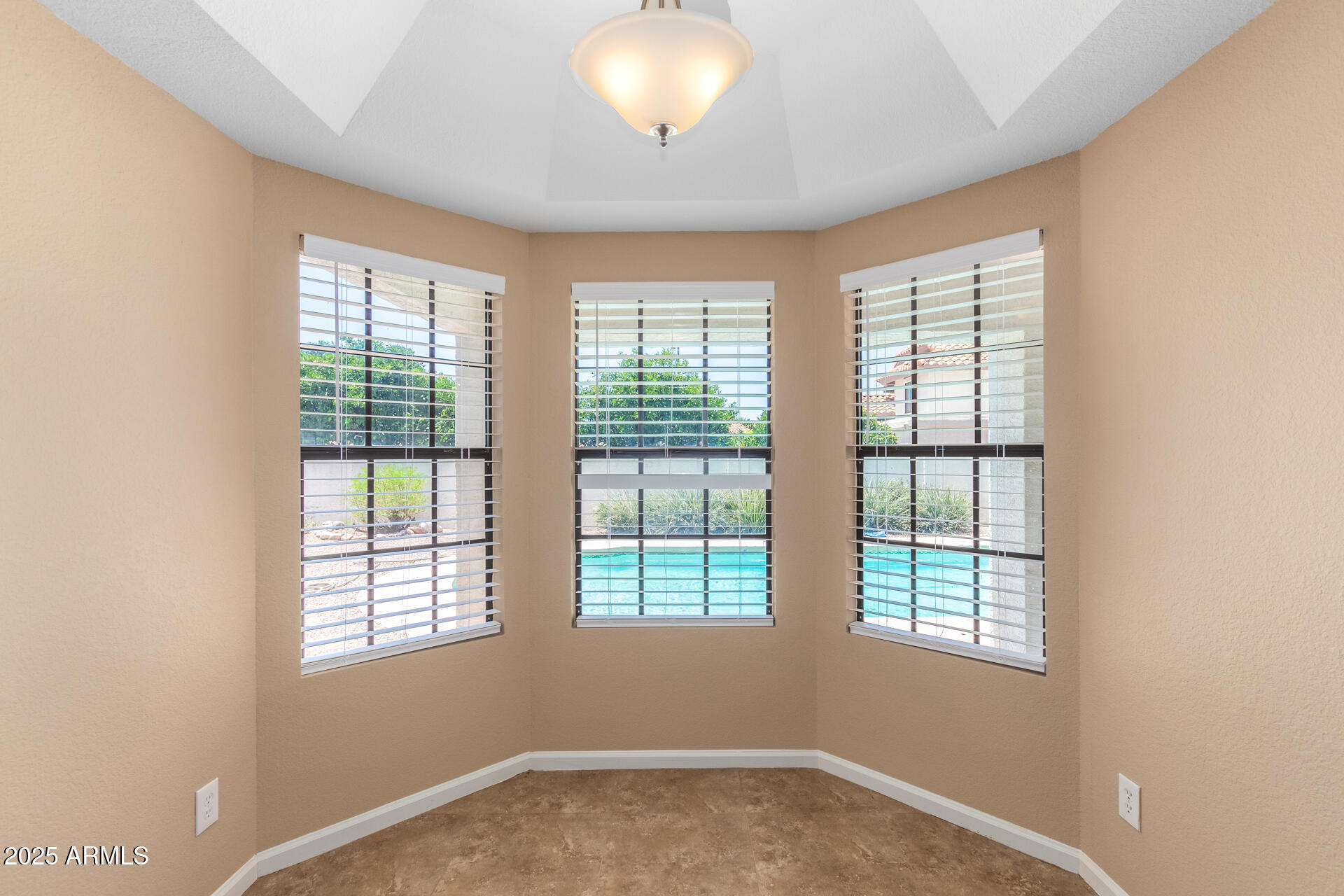 6121 East Saddleback Street Mesa, AZ 85215 - Photo 12 of 36 an empty room with a window