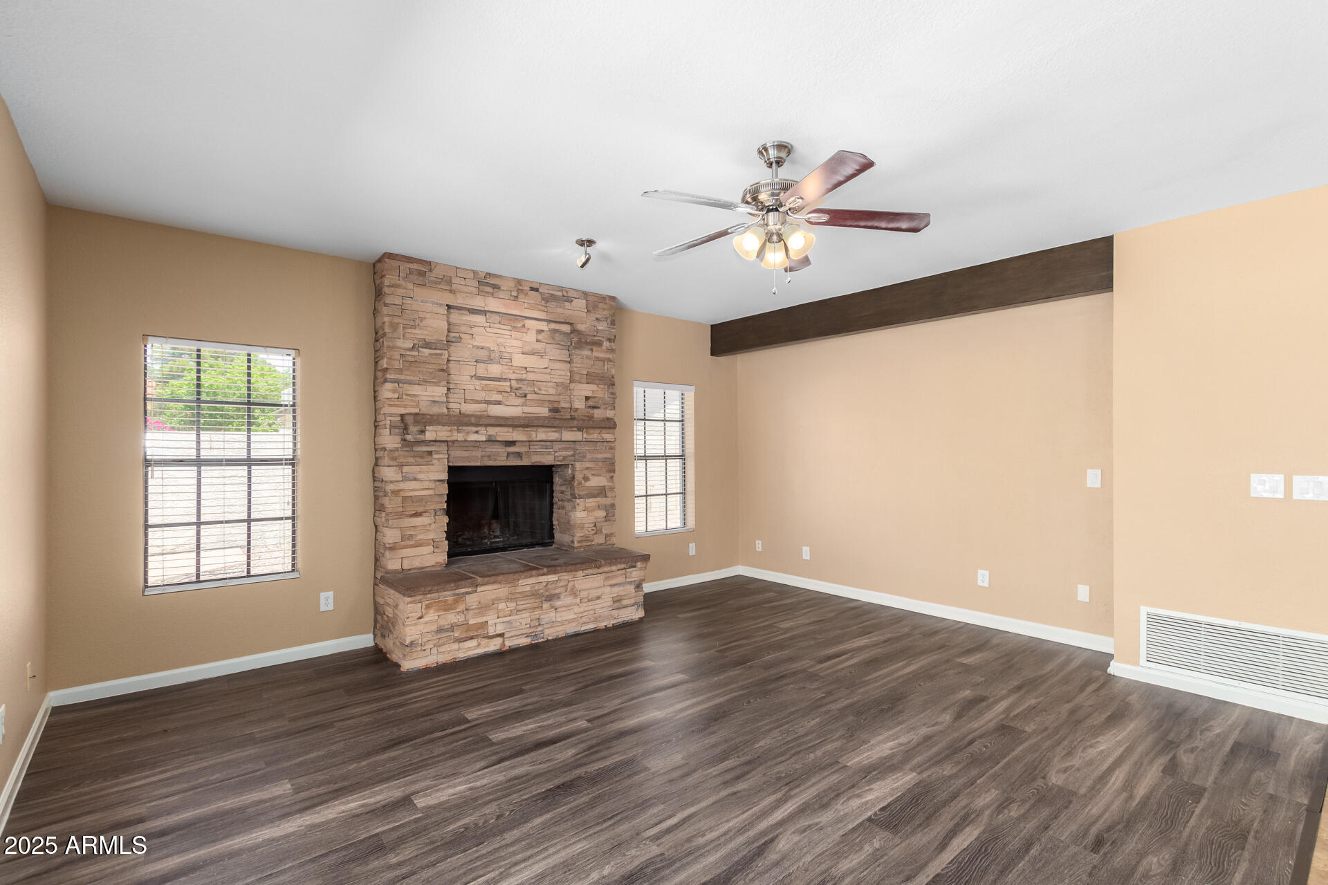 6121 East Saddleback Street Mesa, AZ 85215 - Photo 15 of 36 a view of an empty room with a window and wooden floor
