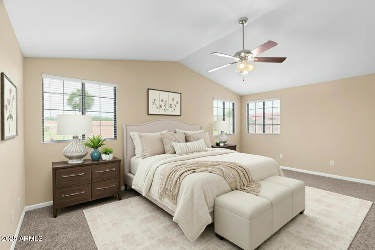 6121 East Saddleback Street Mesa, AZ 85215 - Photo 17 of 36 a bedroom with a bed and ceiling fan