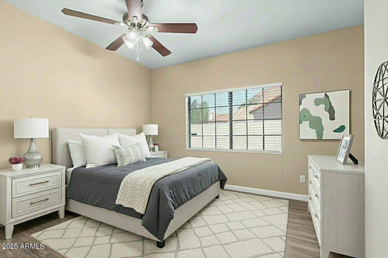 6121 East Saddleback Street Mesa, AZ 85215 - Photo 23 of 36 a bedroom with a bed and a window