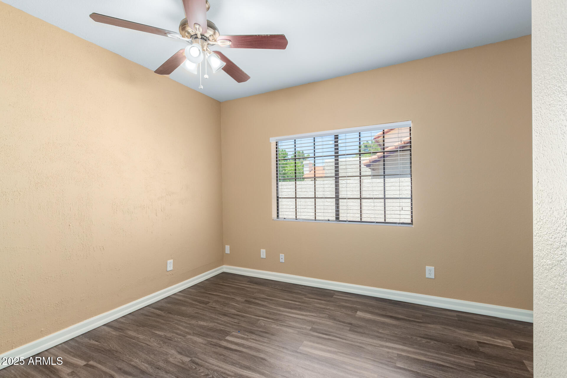 6121 East Saddleback Street Mesa, AZ 85215 - Photo 24 of 36 wooden floor in an empty room with a window
