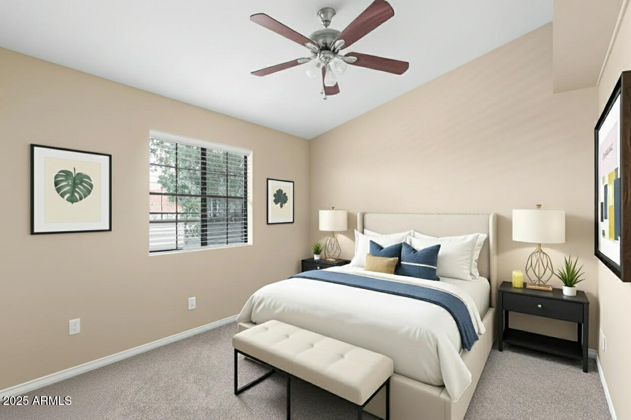 6121 East Saddleback Street Mesa, AZ 85215 - Photo 27 of 36 a bedroom with a bed and a chandelier