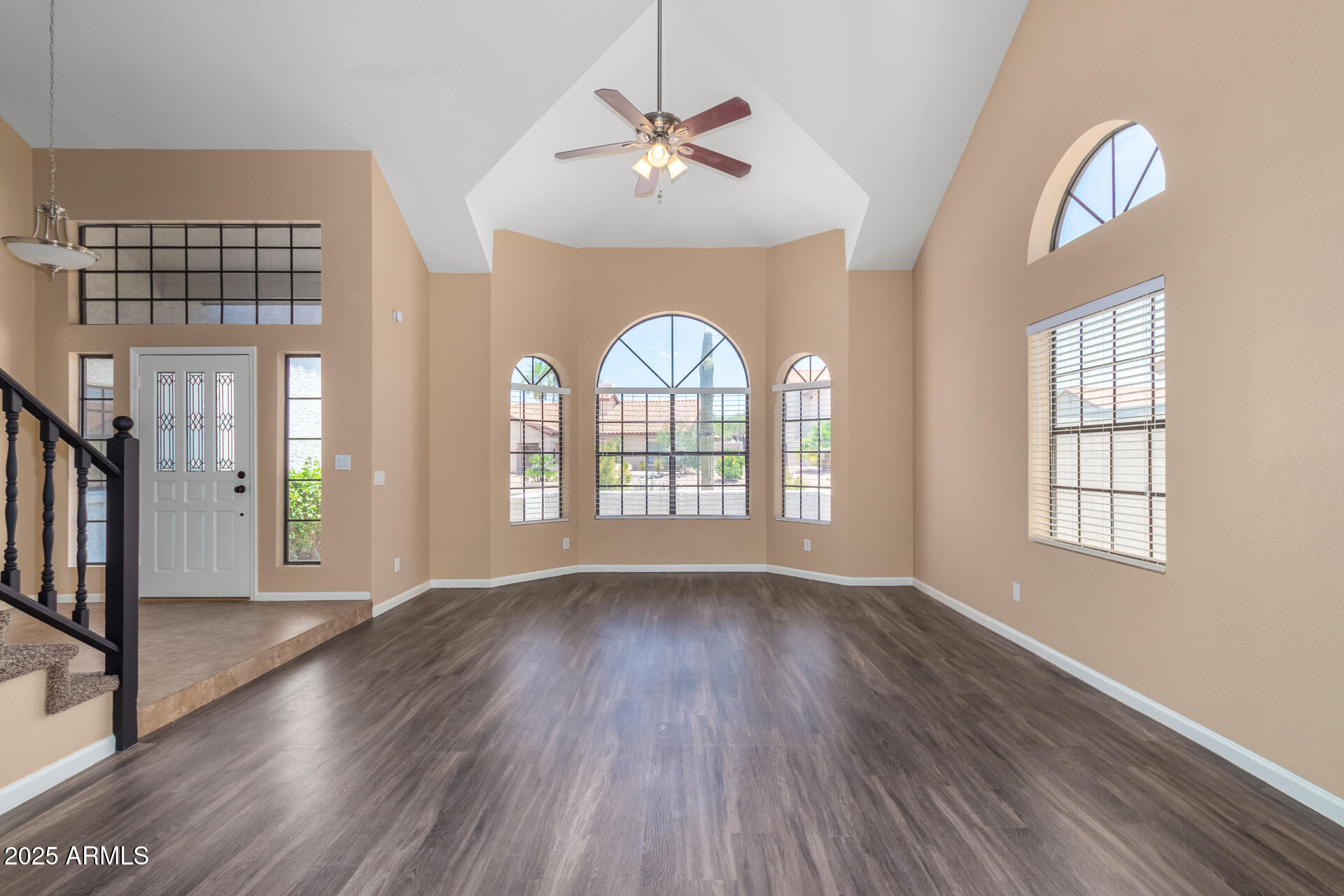 6121 East Saddleback Street Mesa, AZ 85215 - Photo 3 of 36 a view of an entryway with wooden floor and a window