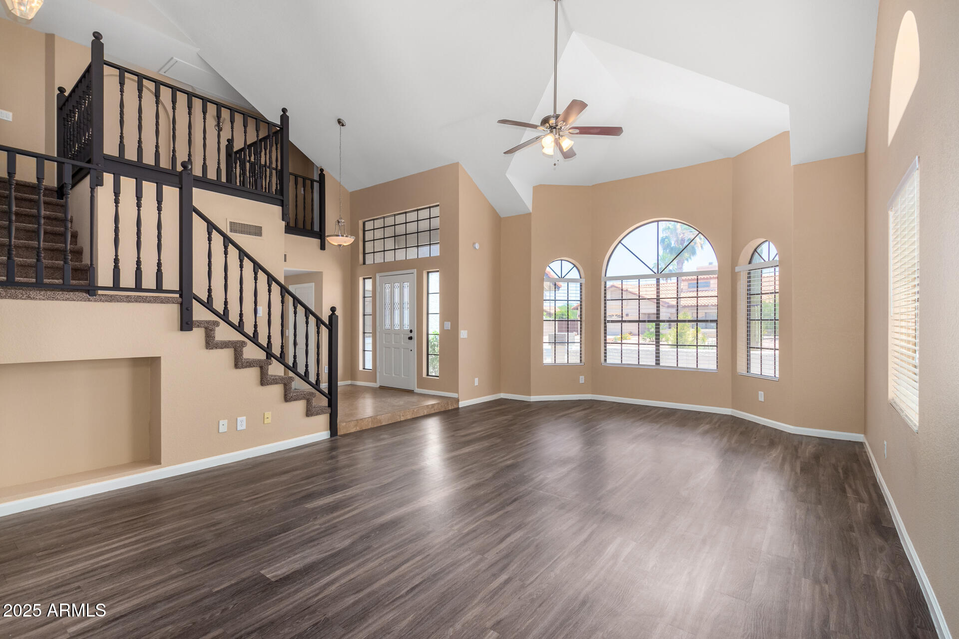 6121 East Saddleback Street Mesa, AZ 85215 - Photo 5 of 36 a view of an entryway with wooden floor fan and a window