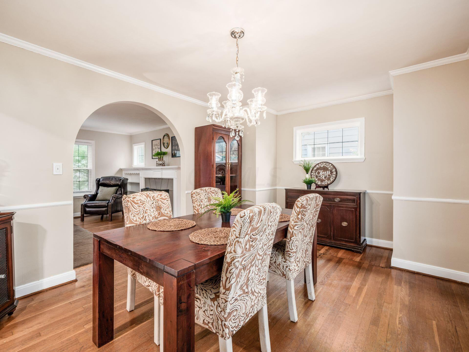 1013 Vernon Road Columbus, OH 43209 - Photo 8 of 53 Formal dining room has a graceful arched entrance to living room in addition to glass, French doors that lead to the 3-season room