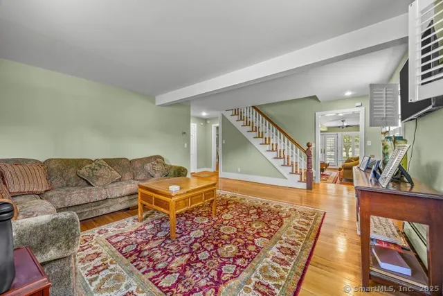 a living room with furniture and a rug