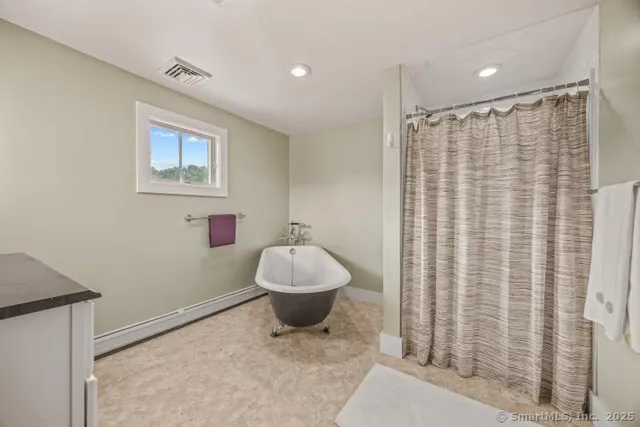 a bathroom with a sink and a shower