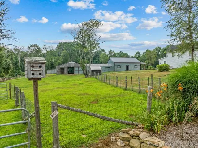 a view of a park with iron fence