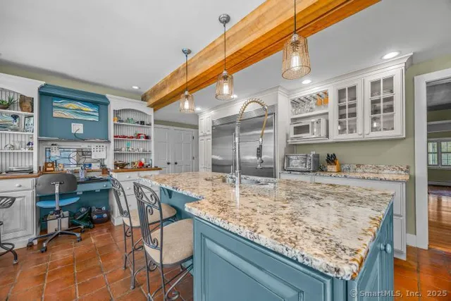 a view of a kitchen and dining room