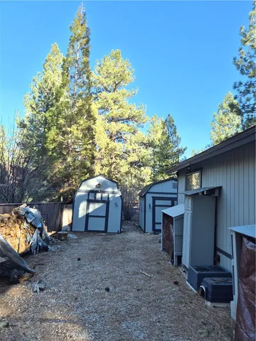 a view of a wooden door and a yard
