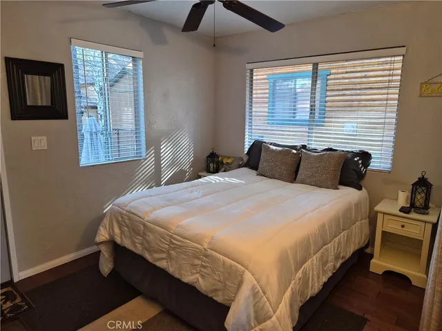 a bedroom with bed and window