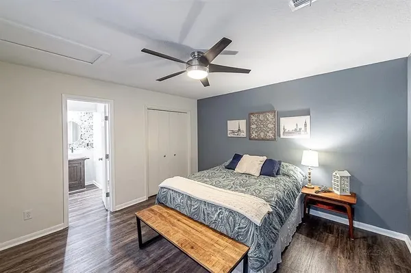 a bedroom with a bed and a table