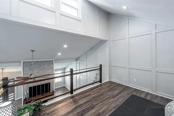 a view of an empty room with kitchen