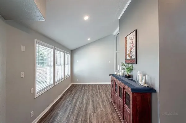 a view of an entryway with wooden floor