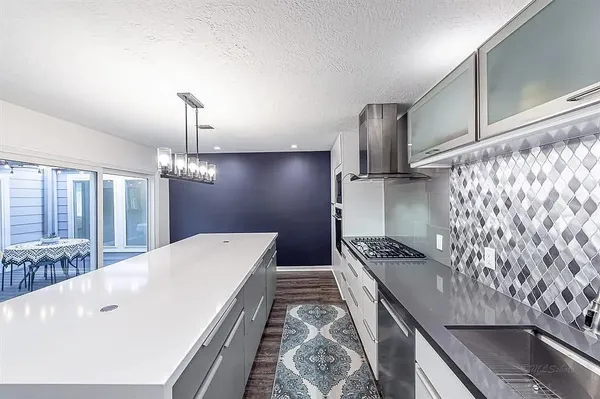 a kitchen with sink and stove