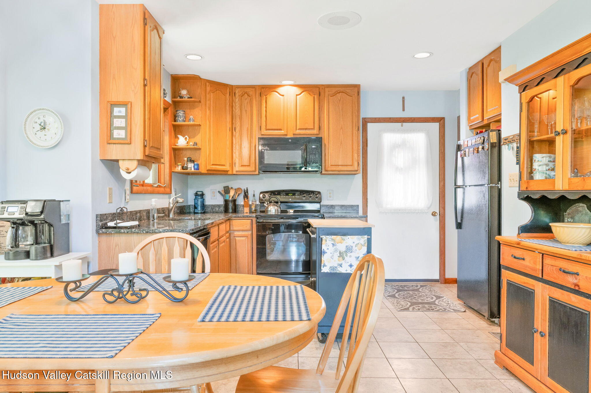 377 Tommy Trail Athens, NY 12015 - Photo 11 of 41 a kitchen with stainless steel appliances granite countertop a refrigerator a sink a stove and white cabinets
