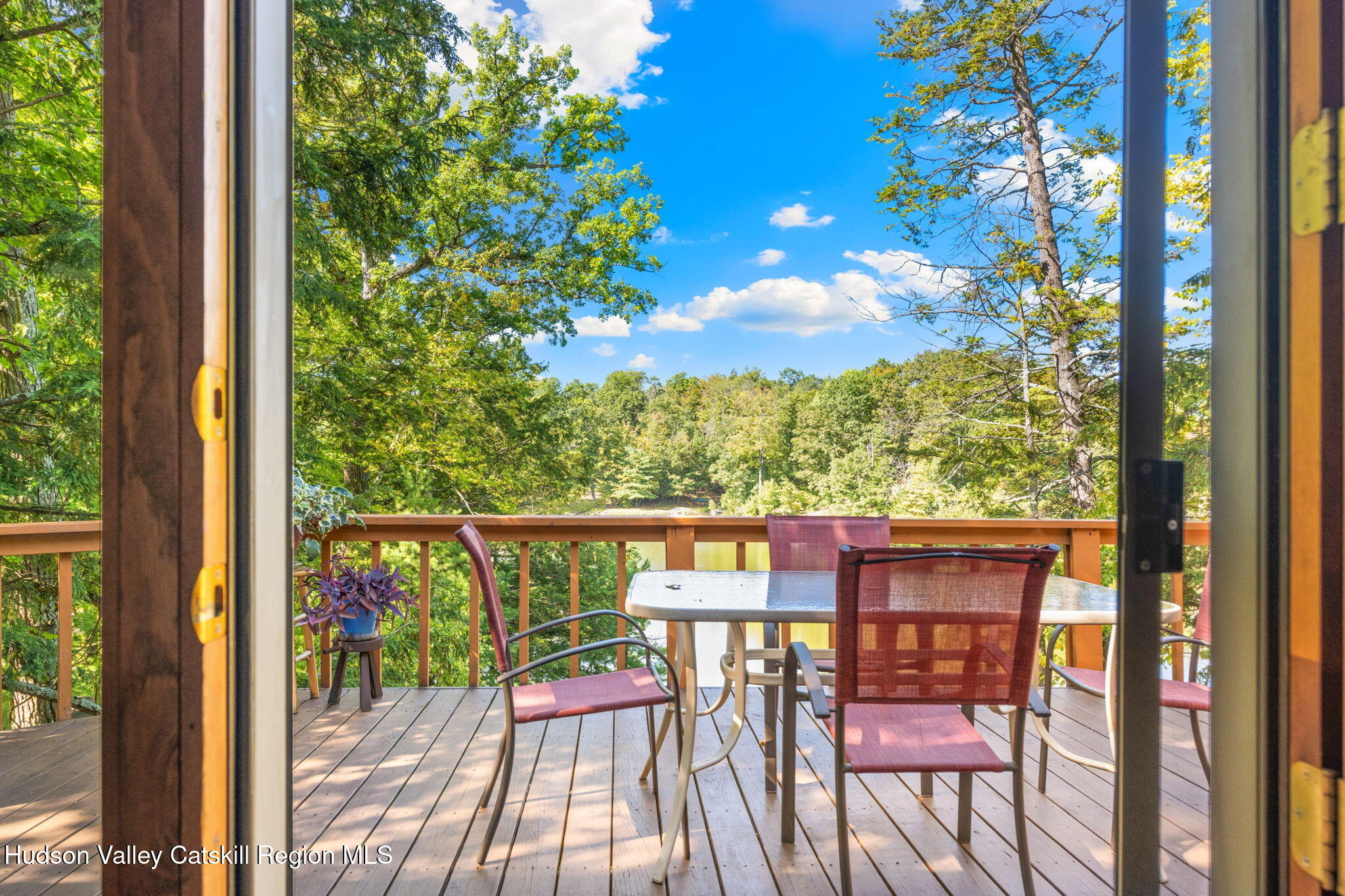 377 Tommy Trail Athens, NY 12015 - Photo 22 of 41 a balcony with wooden floor and outdoor seating