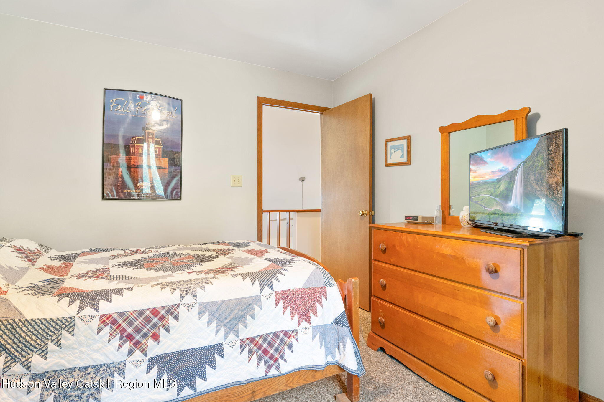 377 Tommy Trail Athens, NY 12015 - Photo 27 of 41 a bedroom with a bed and a painting on the wall