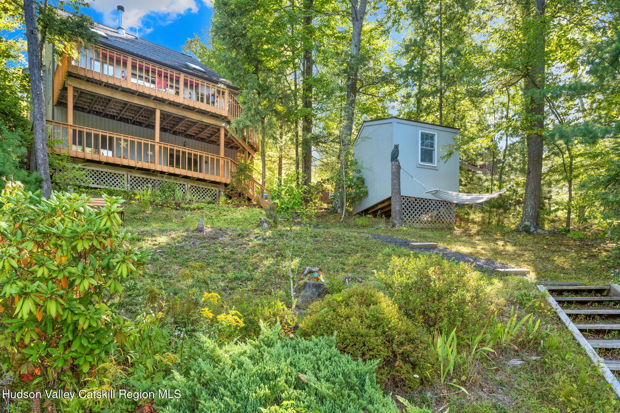 377 Tommy Trail Athens, NY 12015 - Photo 38 of 41 a backyard of a house with a yard and outdoor seating