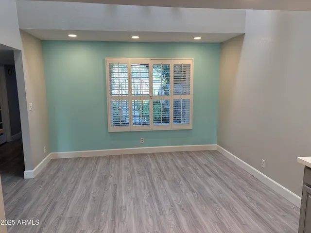 a potted plant sitting on the side of a brick building