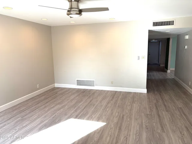a view of a livingroom with wooden floor